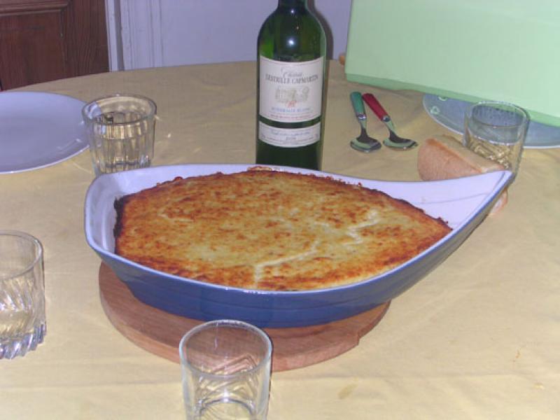 Gratin ou cassolette de poisson et / ou fruits de mer, cuit.