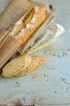  image de l'aliment Pain, baguette ou boule, aux céréales et graines, artisanal
